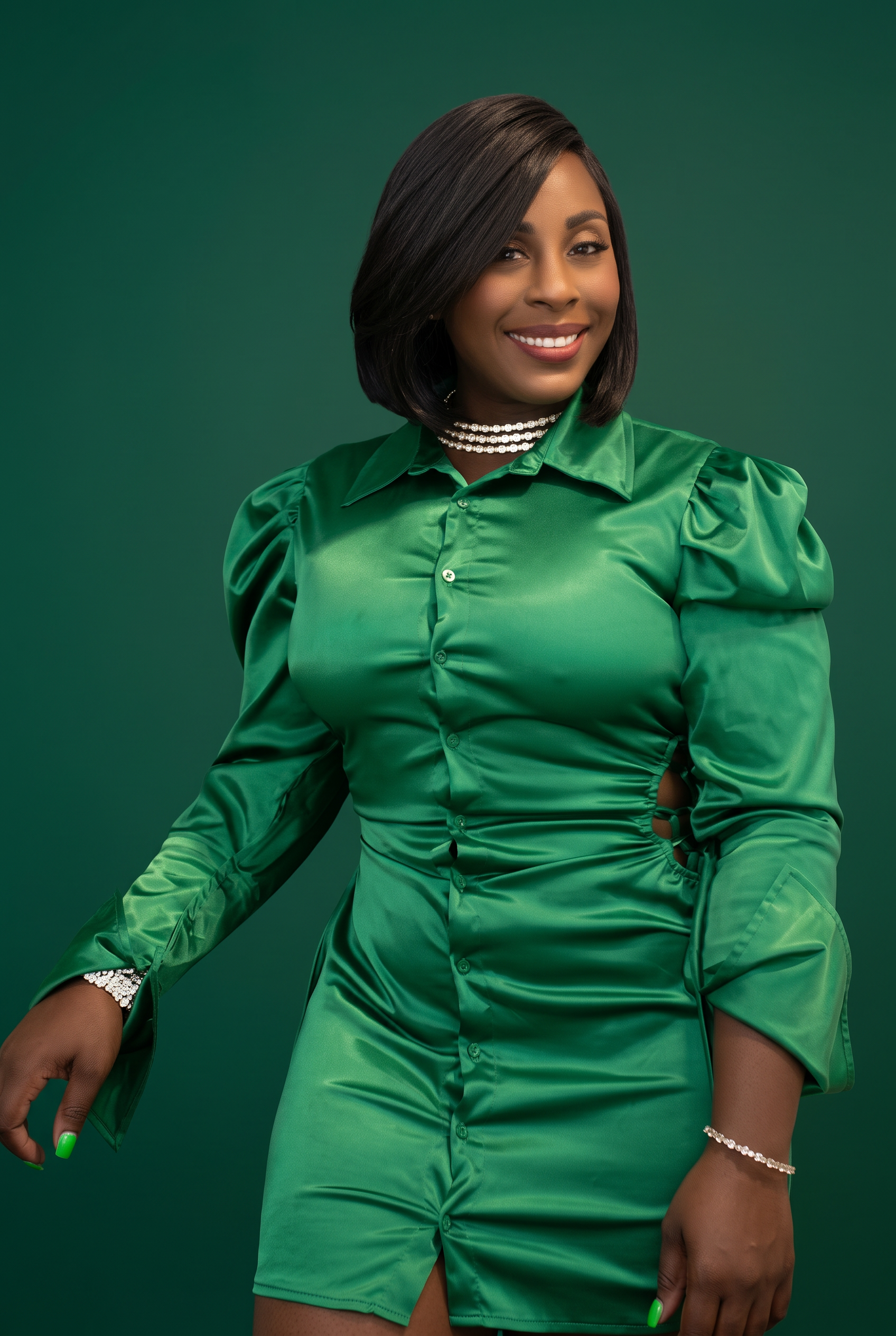 Sabrina Wright, Farmasi Beauty Influencer, in a green satin dress
